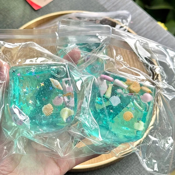 Squishy «кубик льда с ракушками» flippy, 5×5×5 см, бирюзовый 6
