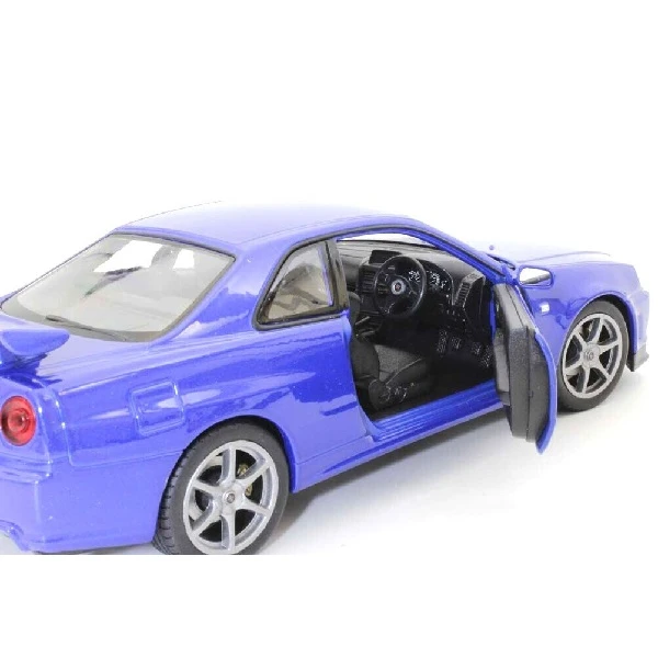 Коллекционный автомобиль die cast nissan skyline gt-r 1:24 welly 4